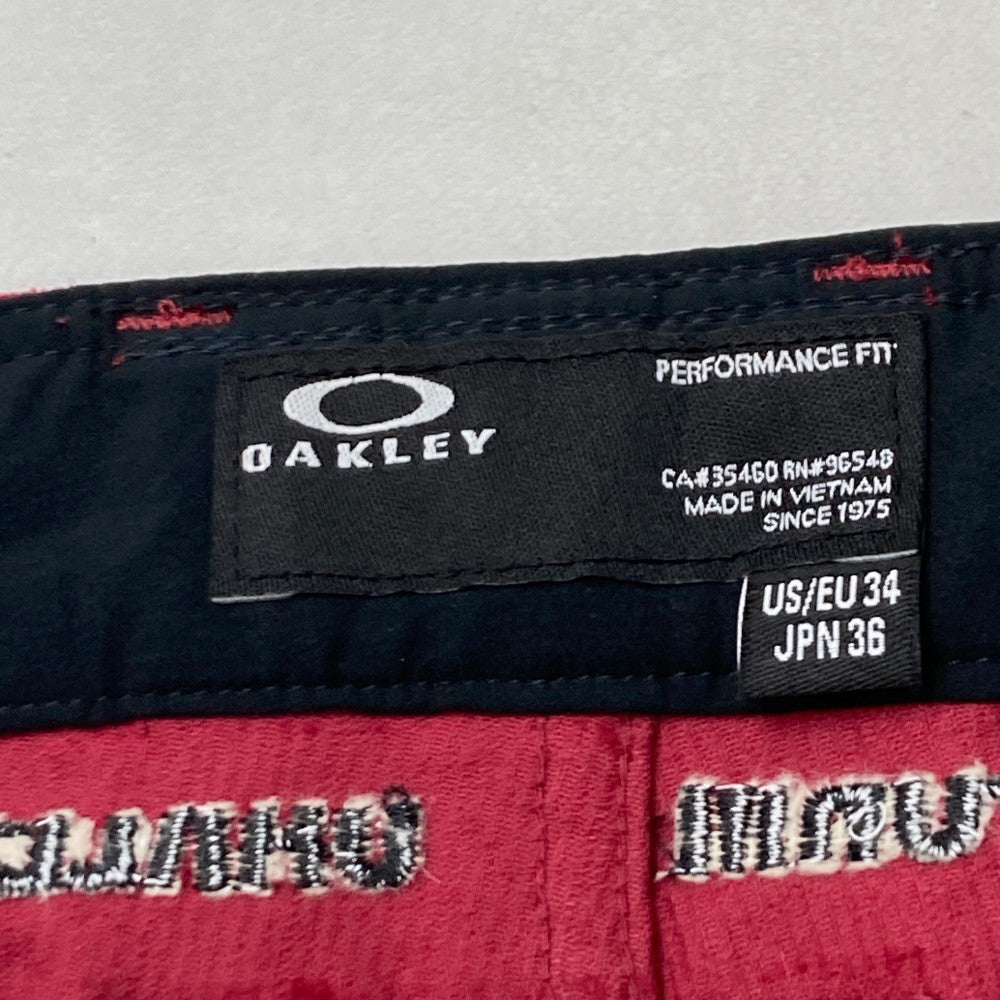 OAKLEY オークリー  コーデュロイ ロングパンツ 総柄 レッド系 36
