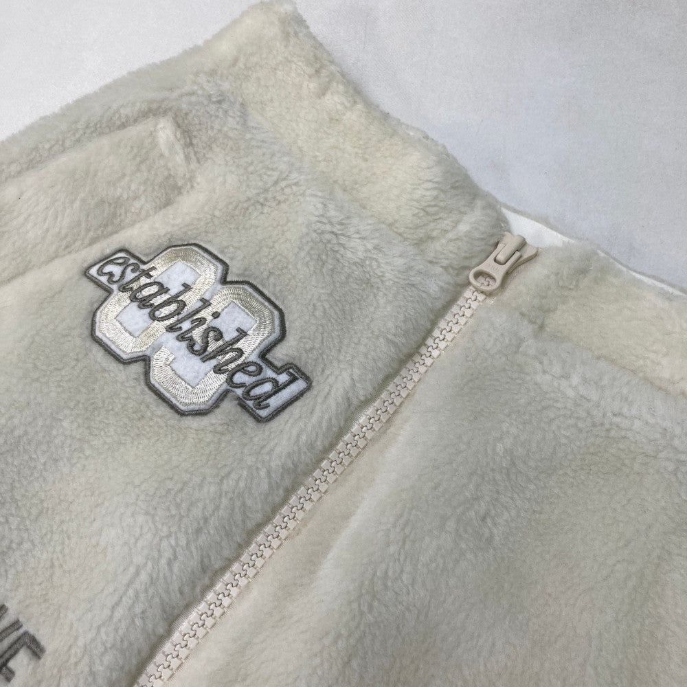 PEARLY GATES パーリーゲイツ 2023年モデル ; ボア ジップスカート ニコちゃん カレッジロゴ ホワイト系 0